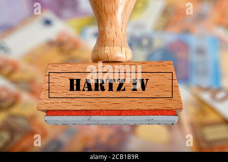 PHOTOMONTAGE, symbolic picture of unemployment during the Corona crisis, stamp with inscription HARTZ IV, Germany Stock Photo