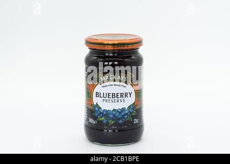 Irvine, Scotland, UK - August 08, 2020: MACKAYS Branded jar of blueberry preserve, jam in recyclable glass jar. Stock Photo