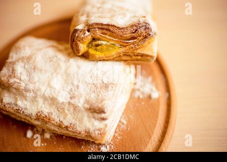 Buns with pineapple jam in an wooden board on the table. Stock Photo
