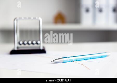 Office workspace with documents, a pen and folders, white background, home office workplace Stock Photo