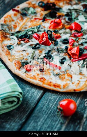 Three pizzas served over the table in the open-air restaurant. Delisous pizza. Stock Photo