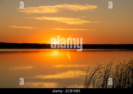 Picturesque sunset over the lake Stock Photo