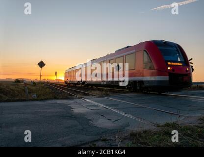 railcar crossing a dangerous, unguarded road crossing Stock Photo