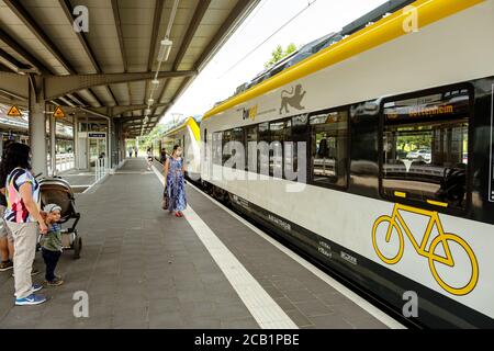 Titisee-Neustadt, Baden-Württemberg, Germany - July 28 2020 : Passenger train from bwegt (DB regio) in the Titisee railway station, passengers with fa Stock Photo