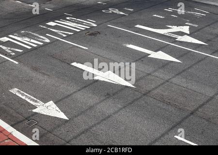 Road surface arrow markings on asphalt in New York City, USA. Stock Photo