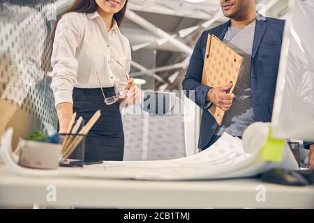 Two office workers discussing their new project Stock Photo