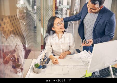 Positive delighted people discussing their new project Stock Photo