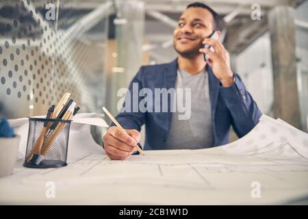 Focused photo on male hand holding pencil Stock Photo