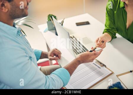 Focused photo on man that stretching hand Stock Photo