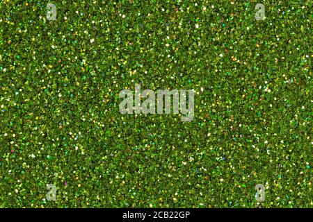 Light green glitter background with brilliance close-up. Stock Photo