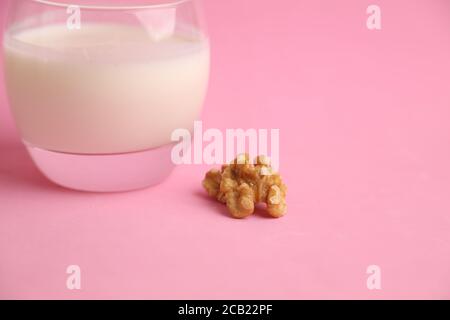 Closeup shot of a glass of walnut milk isolated on a white background Stock Photo