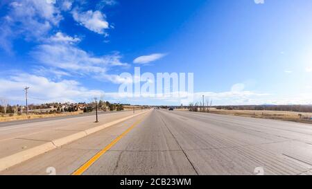 Driving on typical paved roads in suburban America. Stock Photo