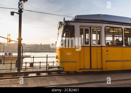 BUDAPEST, HUNGARY - January 27, 2019: Yellow tram in Budapest near the embankment on the Pest side in Budapest. Line 2 Tram in Budapest Stock Photo