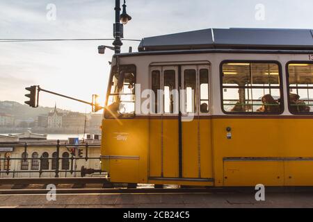 BUDAPEST, HUNGARY - January 27, 2019: Yellow tram in Budapest near the embankment on the Pest side in Budapest. Line 2 Tram in Budapest Stock Photo