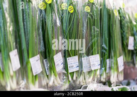 Krasnoyarsk, Russia, August 10, 2020: fresh Packed leeks in cellophane packaging in the store. Stock Photo