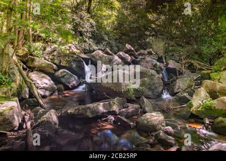 Boulders in the stream have created a beautiful landscape Stock Photo