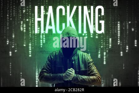 Faceless hacker with HACKING inscription, hacking concept Stock Photo