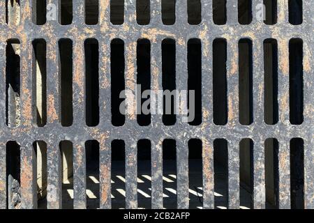 rusty old vintage retro storm drain cover lid shadows suitable for website marketing background backdrop setting architecture architectural layout pat Stock Photo