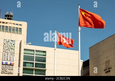 Hong Kong, Hong Kong. 08th Aug, 2020. Peoples Republic of China and the Hong Kong SAR flag fly outside of City Hall and the City Gallery, in Hong Kong Hong Kong, S.A.R., August 08, 2020. (Photo by Simon Jankowski/Sipa USA) Credit: Sipa USA/Alamy Live News Stock Photo