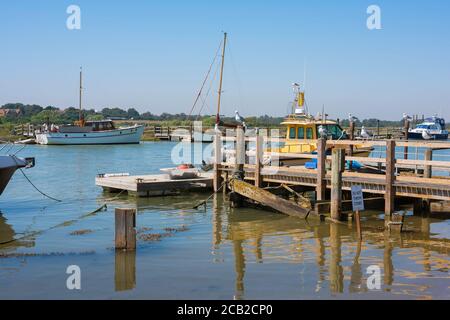 Southwold harbour UK, view in summer of a wooden jetty alongside the River Blyth in Southwold harbour, Suffolk, England, UK Stock Photo