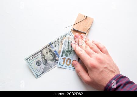 man hand caught in a trap with a bribe Stock Photo