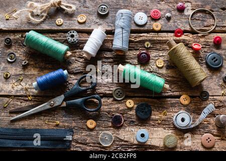 vintage sewing accessories on a wooden background Stock Photo