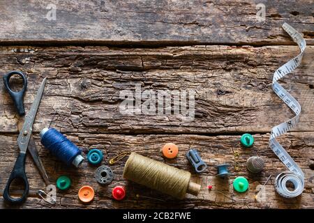 old vintage sewing accessories on a wooden background Stock Photo
