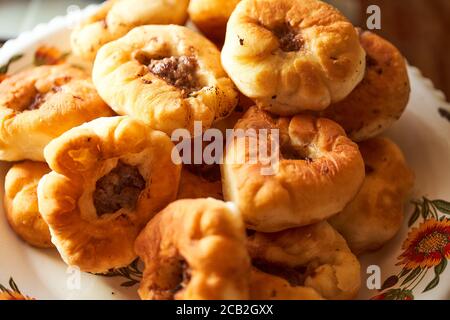 Homemade Meat pies. The traditional Kazakh, Tatar and Bashkir food - belyashi.  Stock Photo