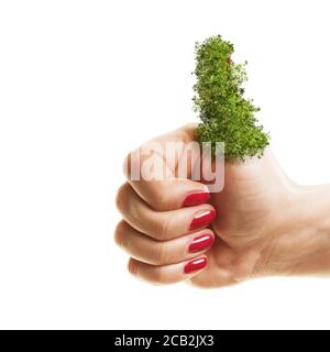 Woman holding her green thumbs up isolated on white background. Planting, gardening and environmental concept. Stock Photo