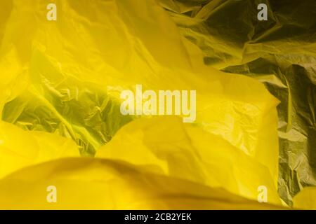 Yellow plastic bag. Plastic bag texture in yellow color. Abstract background and texture for design Stock Photo