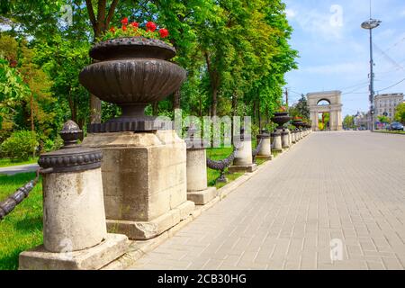 Triumphal Arch and central street in Chisinau . Downtown with pedestrian street in the Capital City of Moldova . Stock Photo