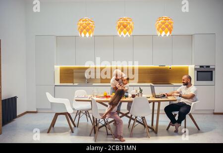 European family having rest at home, evening in kitchen. Family concept Stock Photo