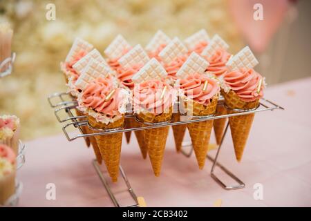 ice cream cone cakes on table Stock Photo