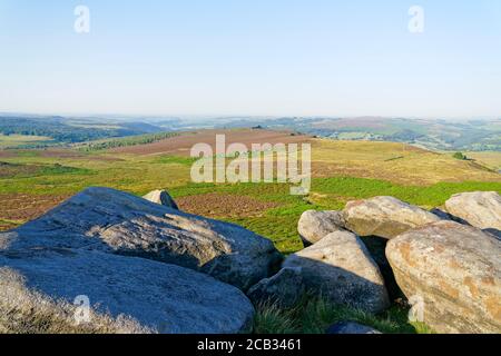 A hazy summer morning on top of Higger tor looking across Hathersage Moor