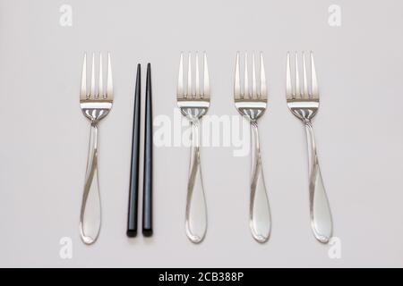 Business concept. Four forks and sticks and wooden sticks. Be different concept Stock Photo