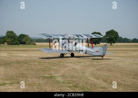 A 1953 Tiger Moth Aircraft on Headcorn airfield in summer. A training airplane. Stock Photo