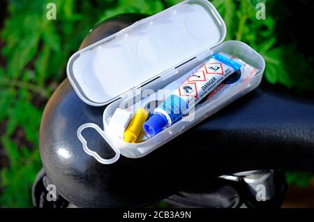 bicycle puncture repair outfit box on bike saddle Stock Photo
