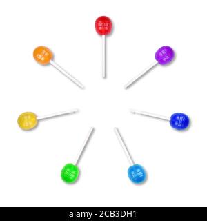 Set of colorful lollipops grouped in a circle isolated on white background. Candy on a stick. Food background. Flat lay. Stock Photo