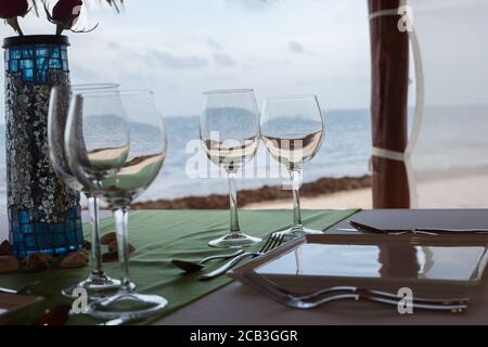 Champagne glasses at a wedding on the beach Stock Photo