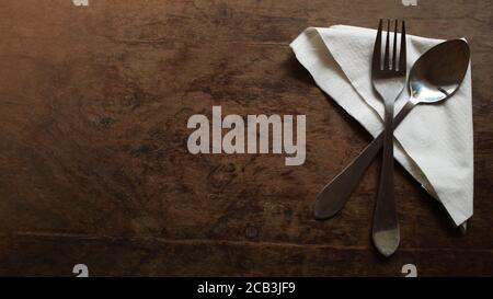 Vintage Silver fork and spoon on a wooden table Stock Photo