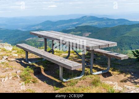 A picnic table sits atop Mt Spokane State Park looking over the Spokane Washington area, from the highest view point in Spokane County Stock Photo