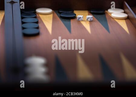 Greece men playing Tavli Backgammon on the street. Backgammon wooden tavli board game. Stock Photo