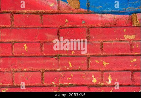 Old brick wall background. Red and blue color. Graffiti Stock Photo