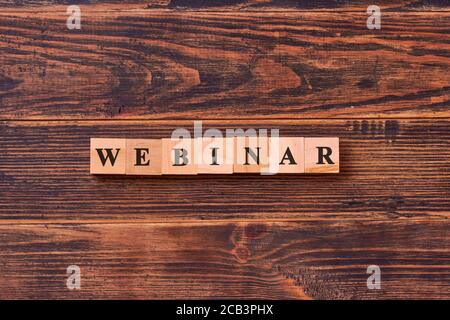 Webinar Text on Wooden Blocks on Dark Background. Online Internet Website Web Page Concept Stock Photo