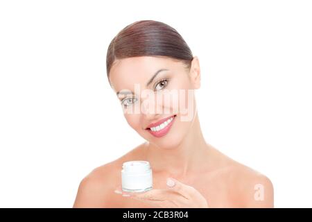 Skincare products, Portrait of Beautiful Young Woman looking at Camera smiling toothy holding cream bottle. Beautiful Asian female model on white back Stock Photo