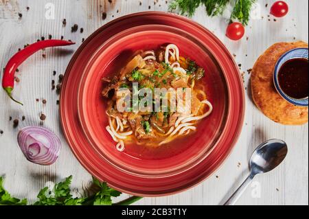 Lagman or Laghman is a Central Asian Dish of Pulled Homemade Noodles, Prepared from a Stringy Dough with a Special Recipe. Traditional Thick Warming Stock Photo