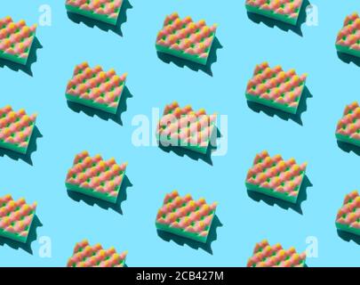 Creative layout with sponges for dishwashing on blue background Stock Photo