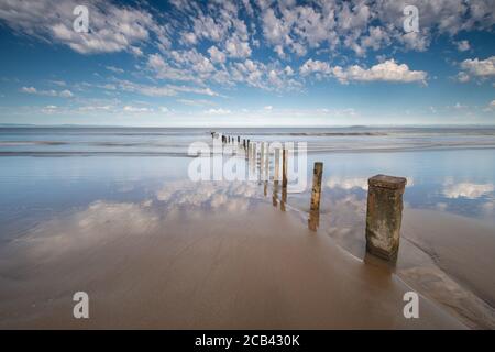 Groynes in the Sand & Sea at Burnham on Sea, Somerset Stock Photo