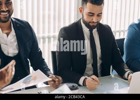 startup business, creative multiethnic business people of different age and races gather in meeting room in white modern office interior, vivously dis Stock Photo