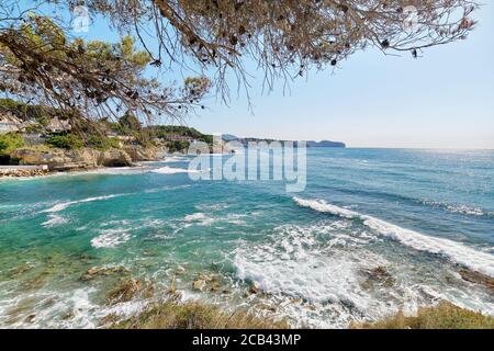 Benissa beach with wavy Mediterranean Sea. Costa Blanca, Province of Alicante, Spain Stock Photo